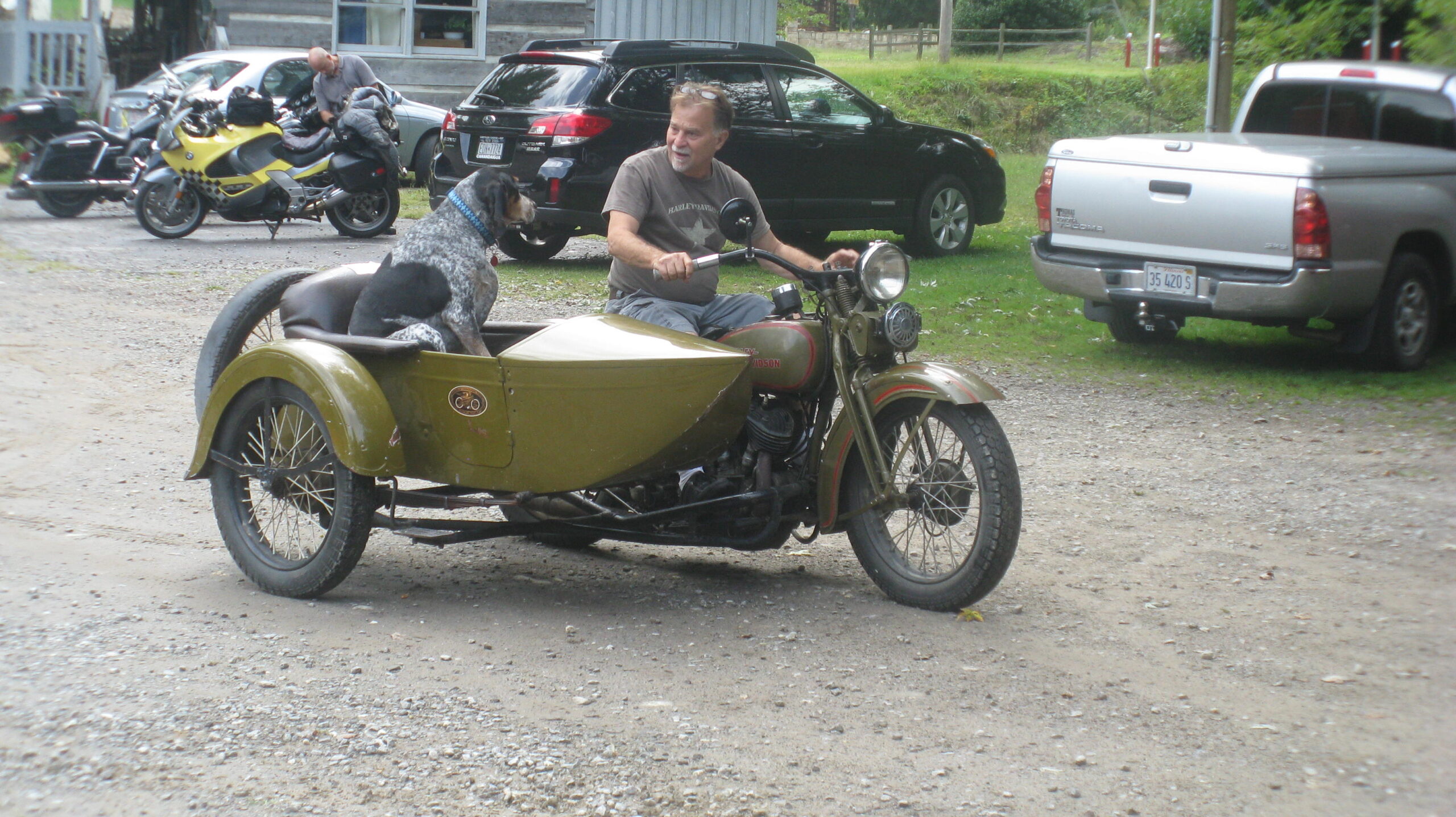 Dale and one of his dogs riding sidecar at Wheels Through Time Museum